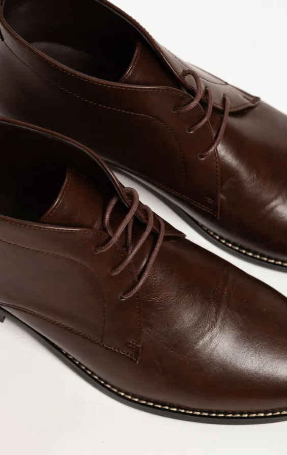 Dunkelbraune Chukka Stiefel mit Spitze - photo 4